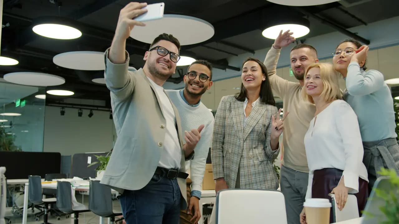 Colleagues having a selfie in the office